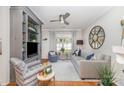 Comfortable living room with built-in shelving, modern furniture, and a bright window at 10617 Fuller Ridge Cir, Charlotte, NC 28270
