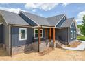 This gorgeous house has navy blue siding, black roof and white trim at 115 Falling Creek Dr, Statesville, NC 28625