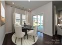 Cozy dining area with a round table, chairs, and sliding doors to the backyard at 1223 Morehead Dr, Salisbury, NC 28144