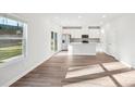 Open-concept living room and kitchen area with light wood floors and ample natural light at 125 Canoga Ave, York, SC 29745