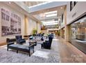 A grand lobby with high ceilings, elegant furnishings, and a stylish design, perfect for residents and visitors at 127 N Tryon St # 404, Charlotte, NC 28202
