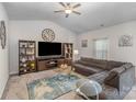 This living room features a large sectional, a flat screen television, and neutral decor at 2030 Lanza Dr, Charlotte, NC 28215