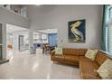 Open-concept living room with modern decor, a leather sofa, and seamless flow to the kitchen at 222 Riverview Ter, Clover, SC 29710