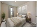 Inviting bedroom with a cozy bed, soft lighting, and a peaceful ambiance for restful nights at 4217 Summit Woods Dr, Charlotte, NC 28216