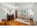 Bright living room boasts hardwood floors, neutral decor, and a large window at 4647 General Pershing Dr, Charlotte, NC 28209