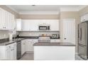 Bright kitchen with stainless steel appliances, granite countertops, and white cabinetry at 4711 Sunburst Ln, Charlotte, NC 28213