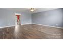 Spacious living room with hardwood floors and neutral paint, creating a cozy atmosphere at 5052 Swinging Bridge Rd, Conover, NC 28613