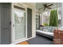 Inviting front porch with a cozy porch swing, perfect for relaxing outdoors at 5663 Morris Hunt Dr, Fort Mill, SC 29708