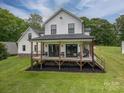 Expansive back porch with seating, perfect for outdoor relaxation and entertaining at 7455 Ivey Dr, Sherrills Ford, NC 28673