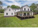 Beautiful two-story home with a spacious covered porch and well-maintained lawn at 7455 Ivey Dr, Sherrills Ford, NC 28673