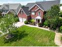 Stunning brick home with a well-maintained lawn and manicured landscaping at 9612 Indian Beech Nw Ave # 1266, Concord, NC 28027