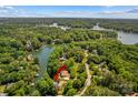 Stunning aerial view of a waterfront property nestled among mature trees on a picturesque lake at 141 Ridge Top Rd, Mooresville, NC 28117
