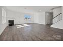 Bright living room features fireplace, and contemporary floors at 14113 New Crest Ln # 162, Huntersville, NC 28078