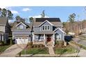 Beautiful home with landscaped yard, featuring a two-car garage, and solar panels at 1502 Matthew Mcclure Cir, Davidson, NC 28036