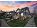 Charming exterior showcasing a covered porch and lush landscaping in a peaceful neighborhood at 1502 Matthew Mcclure Cir, Davidson, NC 28036