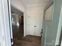 Welcoming foyer with a glimpse of the open living space featuring wood-look flooring and a closet at 1563 Riverview Cir, Fort Lawn, SC 29714