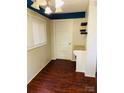 Cozy office space with hardwood floors, bright light, and built-in desk and shelving at 2823 Albany Ln, Charlotte, NC 28205