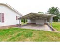 Spacious covered carport and garage offer ample parking and storage, with easy access to the main house at 404 St Lukes Church Rd, Kings Mountain, NC 28086