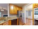 Kitchen features stainless steel appliances, granite countertops, and hardwood floors at 4066 Belle Meade Cir, Belmont, NC 28012