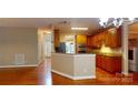 Well-lit kitchen featuring wood cabinets, modern appliances, and an open layout for easy living at 4066 Belle Meade Cir, Belmont, NC 28012