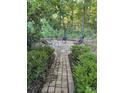 A cozy outdoor patio with comfortable chairs, a table, and a fire pit at 4066 Belle Meade Cir, Belmont, NC 28012