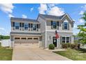 Charming two-story home showcasing well-maintained landscaping, attached garage, and a welcoming entryway at 5325 Merwyn Ave, Charlotte, NC 28215
