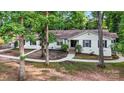Inviting one-story home boasts a well-manicured front yard and a classic brick exterior at 603 Sunnybrook Dr, Monroe, NC 28110