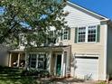 Charming two-story home with a well-maintained lawn, attached garage, and decorative green shutters at 7307 Mitzi Deborah Ln, Charlotte, NC 28269