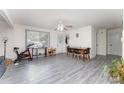 Open-concept area with lots of natural light and grey vinyl floors at 128 Paul Snipes Rd, Lancaster, SC 29720