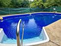 Sparkling in-ground pool with diving board, ladder and fully fenced in perimeter at 128 Paul Snipes Rd, Lancaster, SC 29720