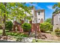 Attractive two-story home featuring well-maintained landscaping and a welcoming front porch at 14940 Carbert Ln, Huntersville, NC 28078