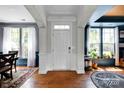 Elegant foyer with hardwood floors, decorative trim, and plenty of natural light at 14940 Carbert Ln, Huntersville, NC 28078