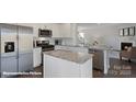 Modern kitchen features stainless steel appliances, granite countertops, and an island for seating at 155 Rustling Waters Dr, Mooresville, NC 28117
