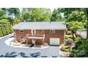 Brick home with a deck, garage, and landscaped backyard at 1602 Brentwood Dr, Newton, NC 28658