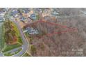 Aerial view of the home and lot, surrounded by lush greenery and neighborhood at 17416 Gillican Overlook Rd, Davidson, NC 28036