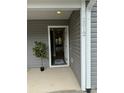 Inviting front entrance featuring a white door, modern siding, and the house number displayed prominently at 2012 Crown Point Dr # A, Albemarle, NC 28001