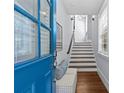 Bright entryway with wood floors, a staircase, bench, and views of the front door at 2906 Hillside Springs Dr, Charlotte, NC 28209