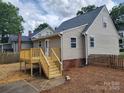 Backyard of home featuring a new wooden deck and a well maintained, fenced-in yard at 406 4Th St, Spencer, NC 28159