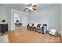 Spacious living room with hardwood floors and a comfortable sofa at 461 Hurston Cir # 51, Charlotte, NC 28208