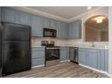 Modern kitchen with stainless steel appliances, ample cabinet storage, and updated countertops at 4938 Sunset Ridge Ct, Charlotte, NC 28269