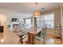 View of the open-concept dining and living area with natural light and neutral colors at 5009 Sharon Rd # E, Charlotte, NC 28210