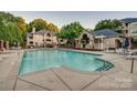 Community pool and outdoor amenity area for residents at 5009 Sharon Rd # E, Charlotte, NC 28210