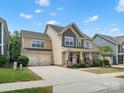 Charming home with a spacious driveway, two-car garage, inviting front porch, and well-maintained landscaping at 5013 Hamilton Mill Dr, Waxhaw, NC 28173