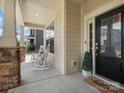 Cozy front porch with rocking chairs, beautiful columns and a welcoming entrance at 5013 Hamilton Mill Dr, Waxhaw, NC 28173