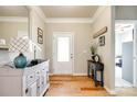 Warm and inviting foyer with hardwood floors and stylish console table at 5025 Kinross Ln, Indian Land, SC 29707