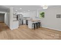 Modern kitchen with stainless steel appliances, butcher block countertops, and breakfast bar at 565 Vine Arden Dr, Salisbury, NC 28146