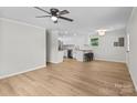 Bright, open living space blending seamlessly with a modern kitchen featuring a breakfast bar at 565 Vine Arden Dr, Salisbury, NC 28146