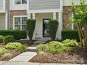 Inviting front porch with landscaped walkway, stone accents, and covered entryway at 8037 Lynwood Sq, Waxhaw, NC 28173