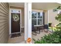 Inviting front porch with seating area, decorative wreath, and welcoming decor at 8317 Dallas Bay Rd, Charlotte, NC 28278