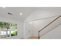 Welcoming foyer with a staircase, natural light, and modern finishes at 8347 Fox Swamp Rd, Charlotte, NC 28215